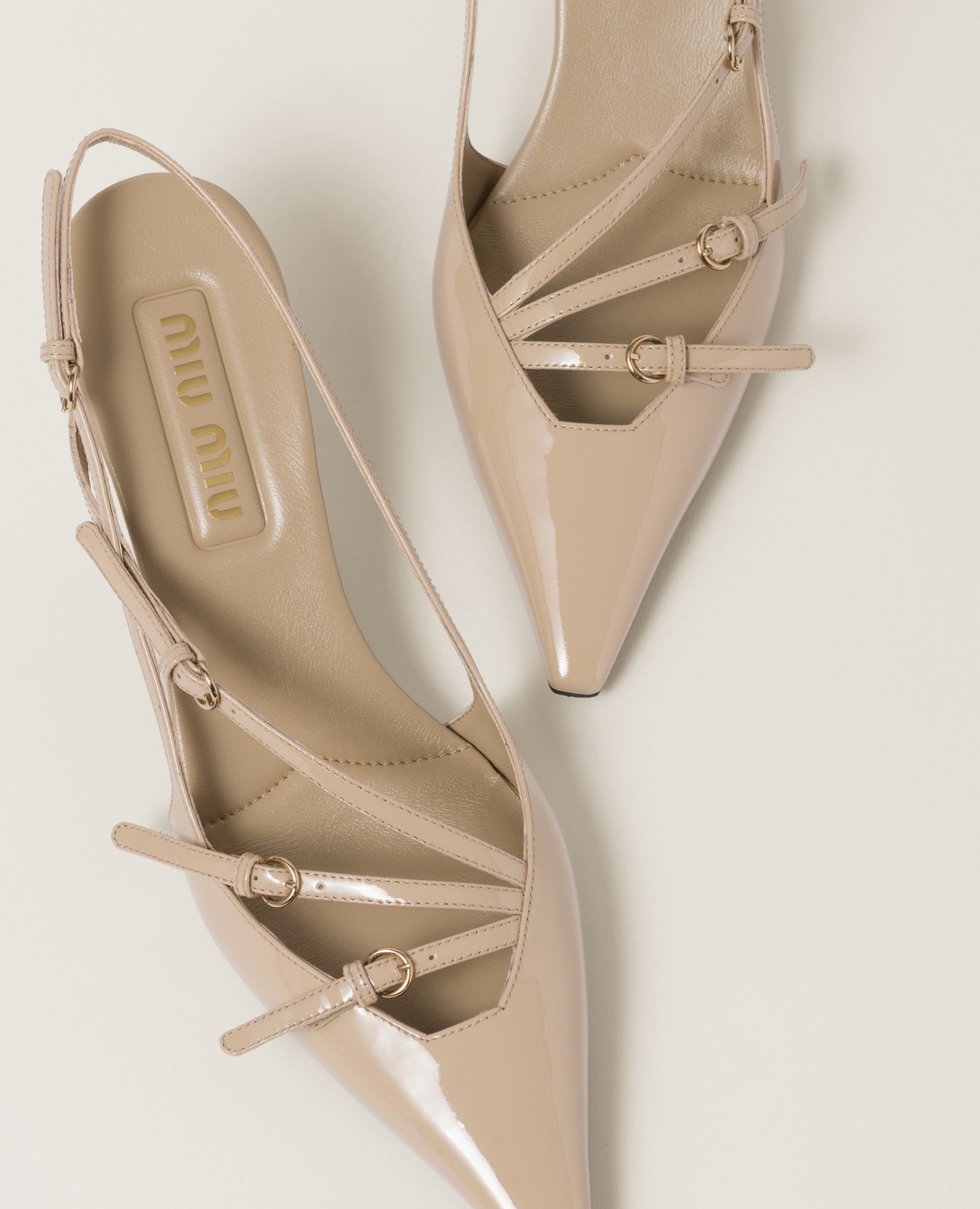 Miu Miu Patent leather slingbacks with buckles Beige